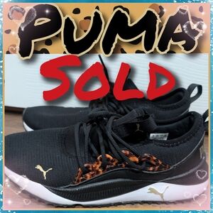 Puma Black Sneakers with Gold and Orange Accents
